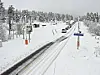 Fredag var det snødekke på riksvei 15 ved Billingen i Skjåk. Nå er det ventet mer snø i fjellet i Sør-Norge. Foto: Statens vegvesen / NTB