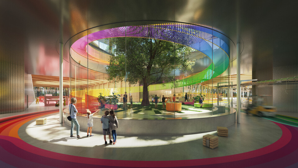 Fabrikken bygges som et et transparent besøks- og opplevelsessenter for publikum. Det åpne atriet i midten omsluttes av en ståltrapp som svinger seg 360 grader langs en buet glassfasade. Herfra er det meningen at de besøkende skal kunne følge fabrikkens aktiviteter i alle de fire fløyene. Illustrasjon: BIG Bjarke Ingels Group