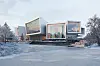 Moderne museumskompleks med store glassfasader i et snødekt landskap.