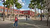 Illustrasjon av et rødt skolebygg med elever som går på en åpen plass med trær.