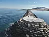 Søndre molo i Svartnes fiskerihavn i Vardø kommune skal rustes opp. Foto: Kystverket